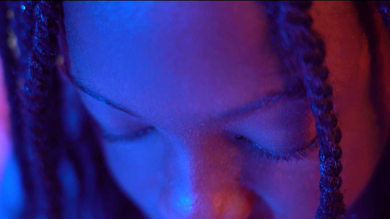 A still from Seriki's short film. At this point, Tami is scrolling through her phone on social media, trying to discover ways to make herself appear more appealing and feminine to adhere to the toxic beauty standards.