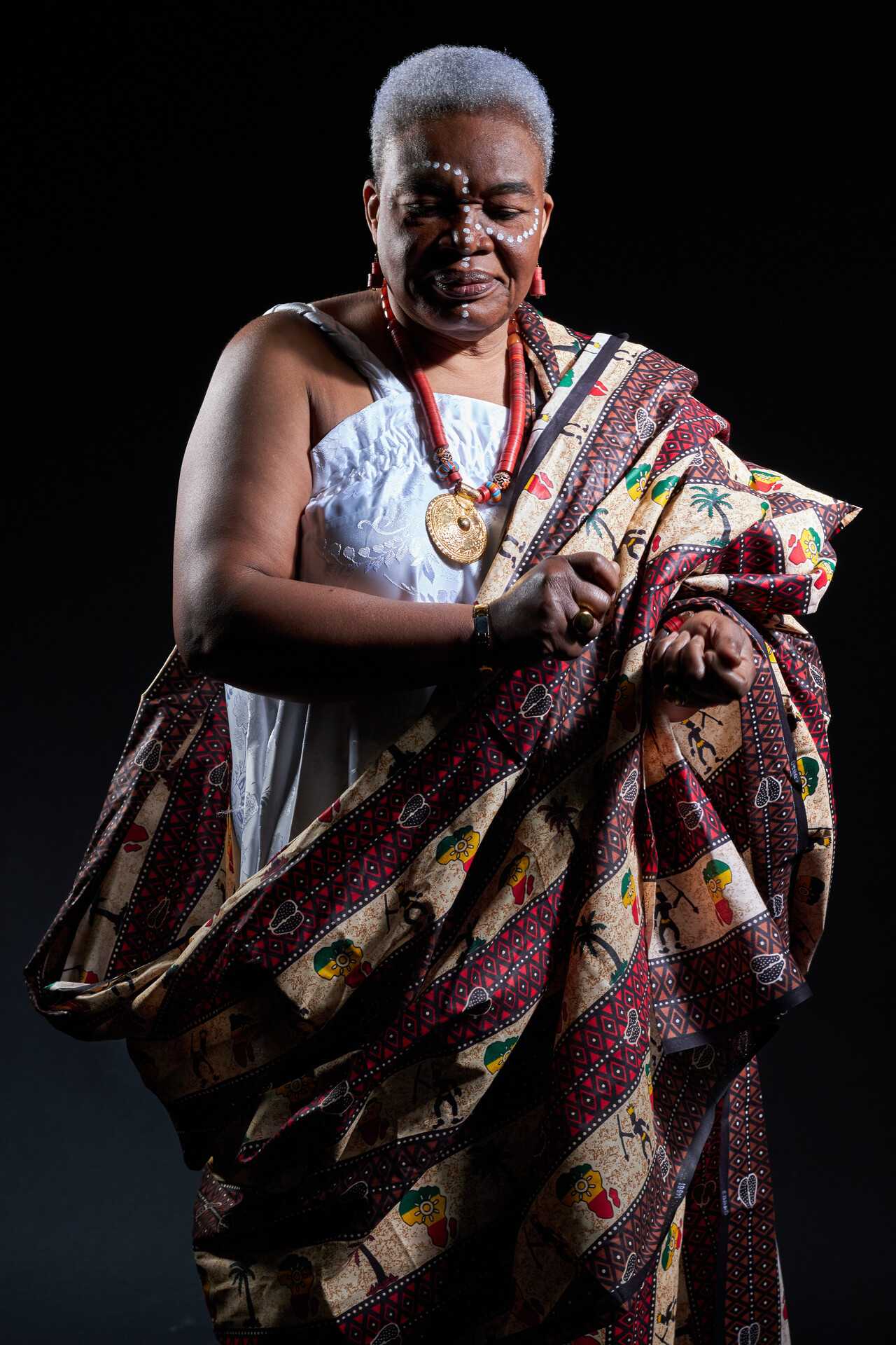 Oyeleke's grandmother dances to a traditional song, fully immersed in her cultural essence. It is a joyful celebration of movement and heritage.