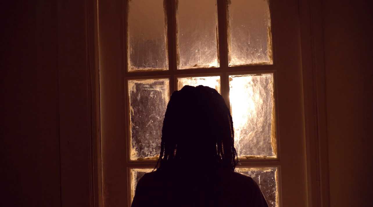 This is a still that happens at the end. Tami has realised that her individuality is what makes her special, it sets her apart from others. The light represents her youth and innocence and she walks into it, reclaiming her identity and therefore her voice.